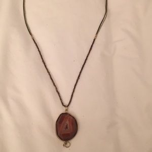 Maroon stone pendant on dark gold necklace!
